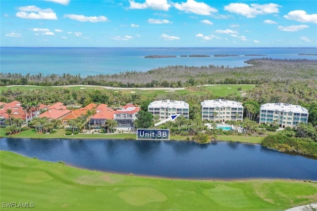 drone / aerial view featuring a water view and view of golf course