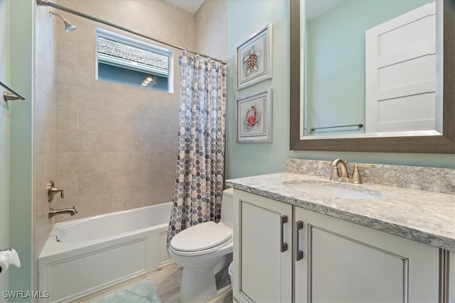 bathroom with shower / bath combo with shower curtain, vanity, and toilet