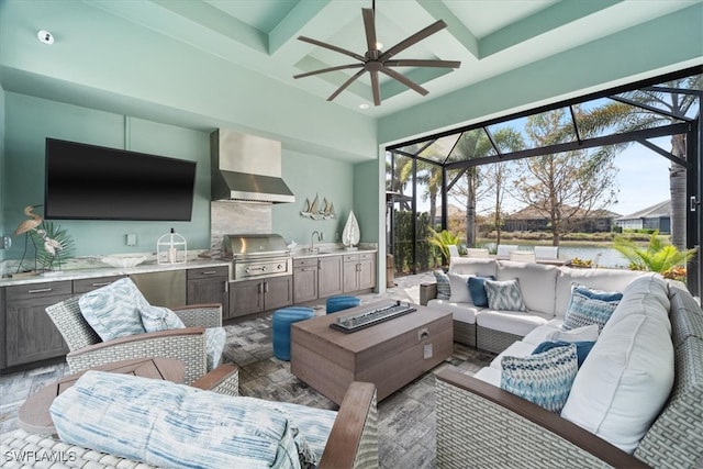 living room featuring ceiling fan, beam ceiling, coffered ceiling, and a sunroom