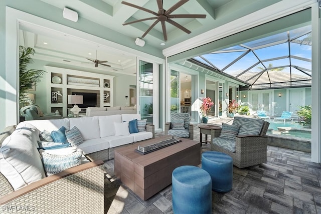 sunroom featuring coffered ceiling and ceiling fan