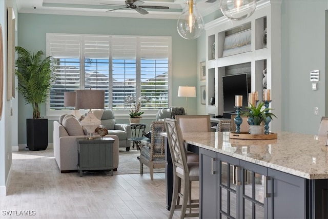 interior space featuring light wood-style floors and a ceiling fan