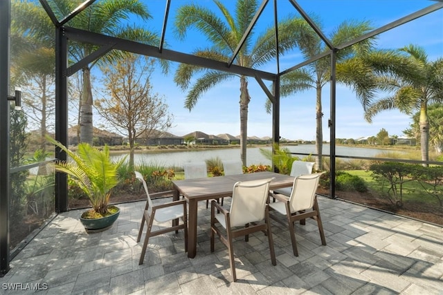 sunroom / solarium with a water view