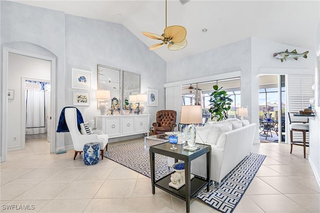 living room with high vaulted ceiling, light tile patterned floors, baseboards, and ceiling fan