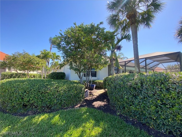 view of yard with a lanai