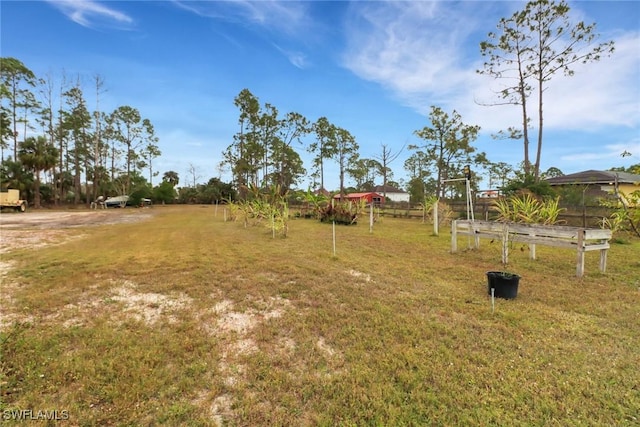 view of yard featuring a garden and fence