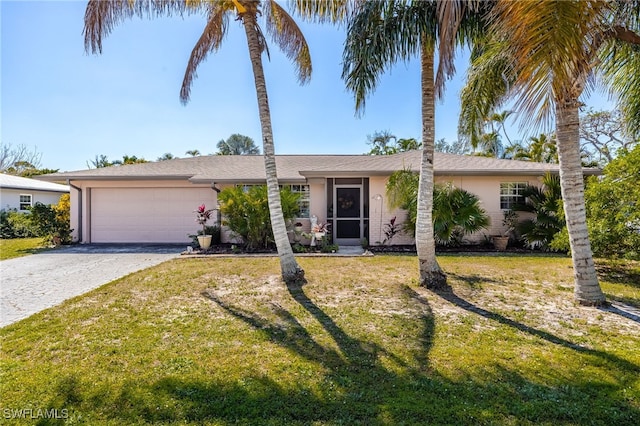 view of front facade with a garage, driveway, a front lawn, and stucco siding