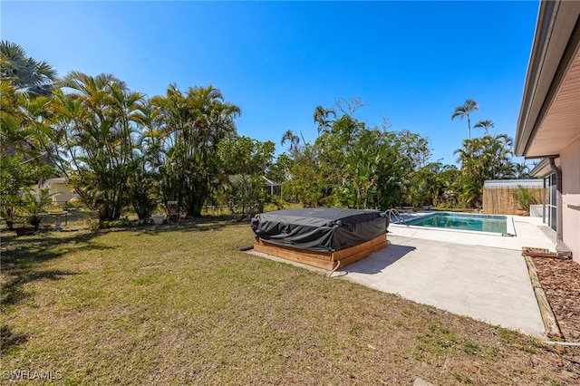 exterior space featuring a patio area, an outdoor pool, and a fenced backyard