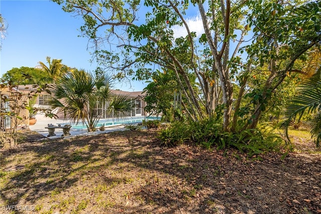 view of yard with an outdoor pool