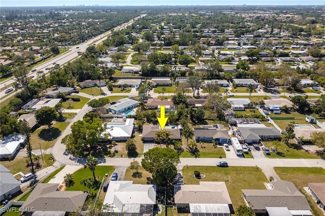 birds eye view of property with a residential view