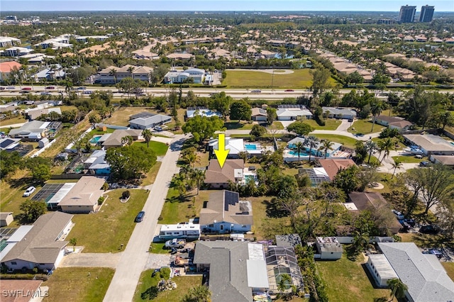 birds eye view of property with a residential view