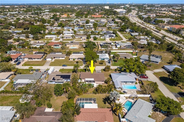 birds eye view of property with a residential view