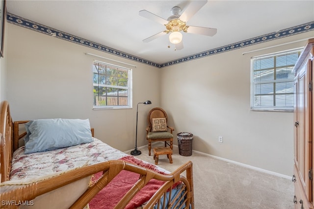 bedroom featuring carpet floors, a ceiling fan, and baseboards