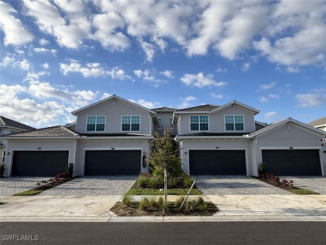 view of front of property with decorative driveway and an attached garage