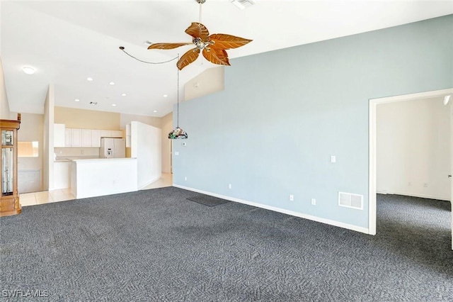 unfurnished living room featuring light carpet, ceiling fan, visible vents, and baseboards