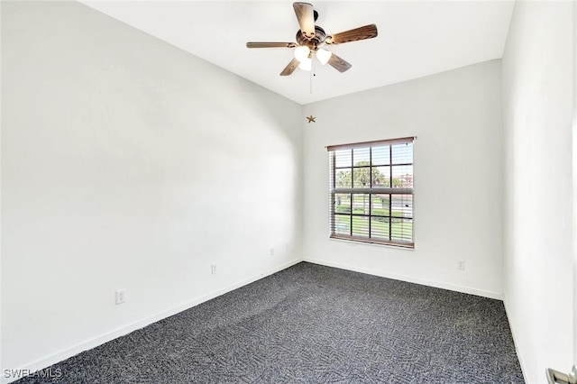 unfurnished room with ceiling fan, dark colored carpet, and baseboards