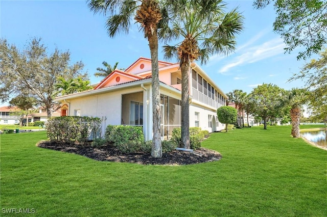 view of property exterior with a lawn and stucco siding