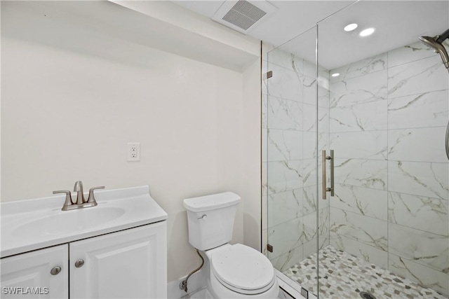 full bath featuring visible vents, toilet, vanity, and a marble finish shower