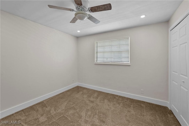 unfurnished bedroom with recessed lighting, a ceiling fan, baseboards, a closet, and carpet