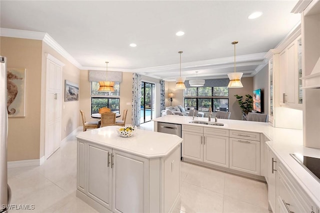 kitchen with light tile patterned floors, a sink, light countertops, a center island, and crown molding