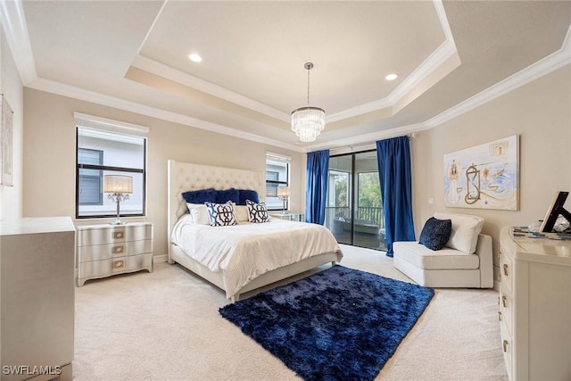 bedroom with access to outside, a tray ceiling, and light colored carpet