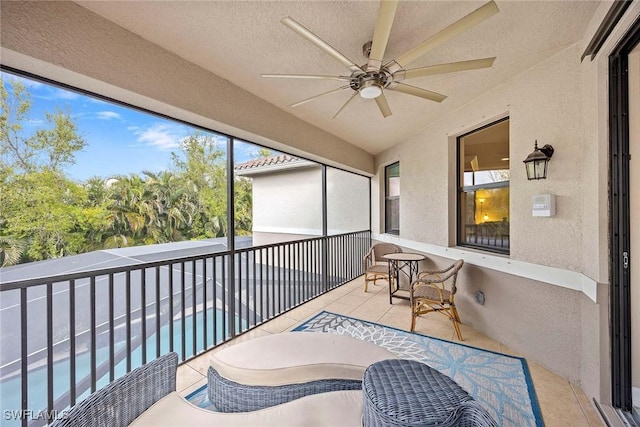 sunroom / solarium featuring ceiling fan