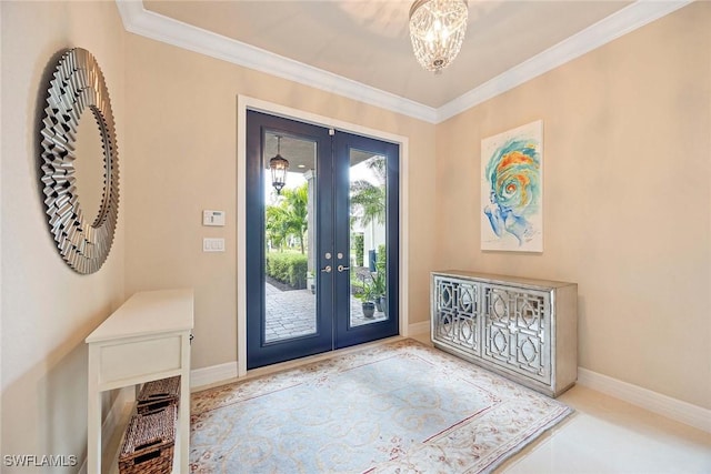 doorway with ornamental molding, french doors, and baseboards