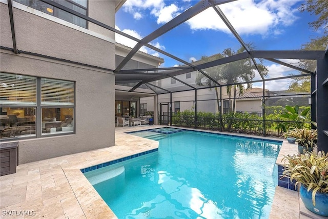 outdoor pool featuring a patio and a lanai