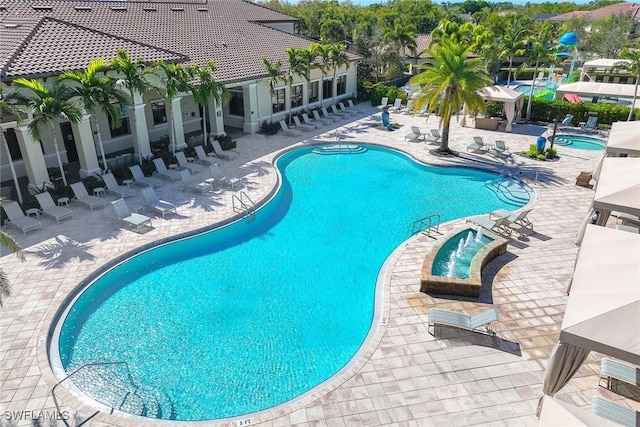 community pool with a patio