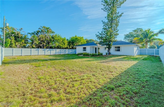 view of yard with a fenced backyard