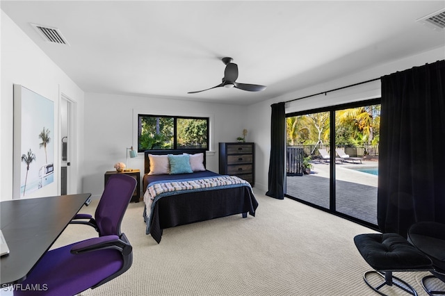 bedroom featuring access to exterior, multiple windows, carpet flooring, and visible vents