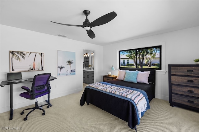 carpeted bedroom featuring visible vents, baseboards, connected bathroom, and a ceiling fan