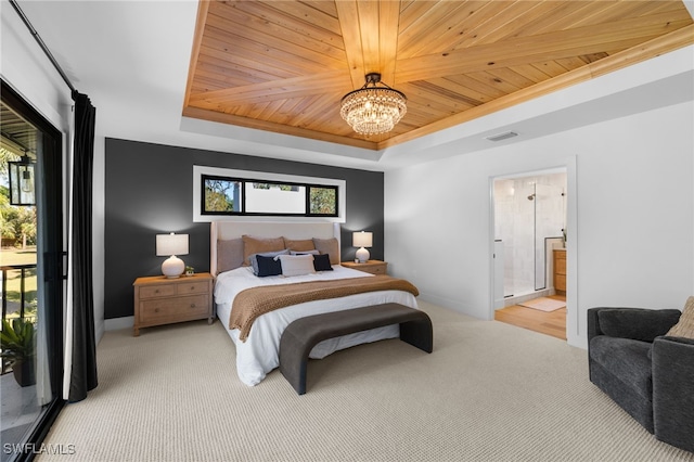 carpeted bedroom with visible vents, a chandelier, wooden ceiling, ensuite bath, and a raised ceiling