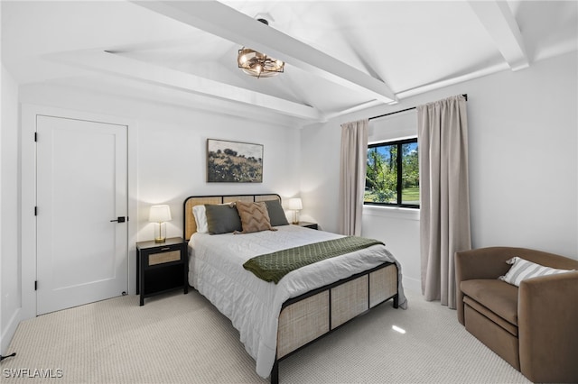 bedroom featuring vaulted ceiling with beams and light carpet