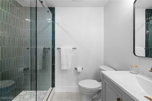 full bath featuring vanity, baseboards, a stall shower, tile patterned flooring, and toilet