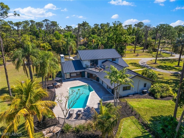 view of swimming pool with a patio, cooling unit, a fenced in pool, a yard, and fence private yard