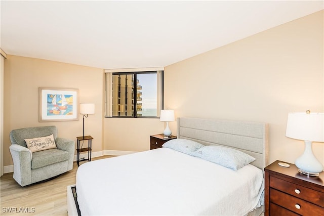 720 S Collier Blvd Unit 1007, Marco Island, FL 34145 - bedroom featuring light wood finished floors and baseboards