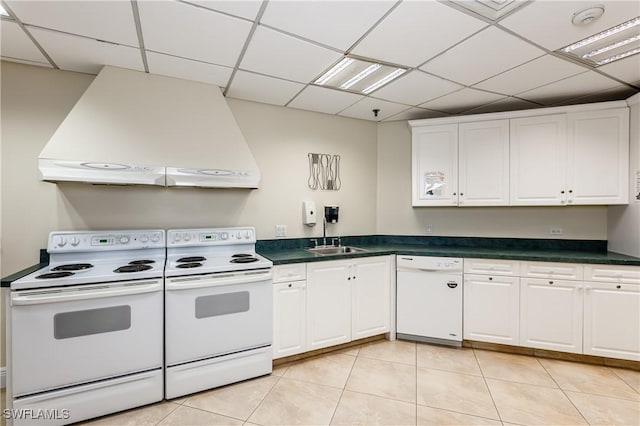 720 S Collier Blvd Unit 1007, Marco Island, FL 34145 - kitchen featuring extractor fan, white appliances, white cabinets, light tile patterned floors, and a drop ceiling
