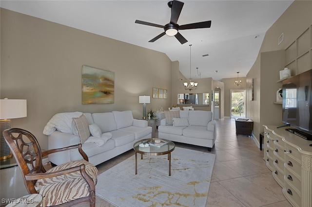 living room with high vaulted ceiling, visible vents, and ceiling fan with notable chandelier