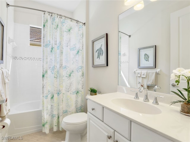 full bath with shower / bath combo, vanity, and toilet