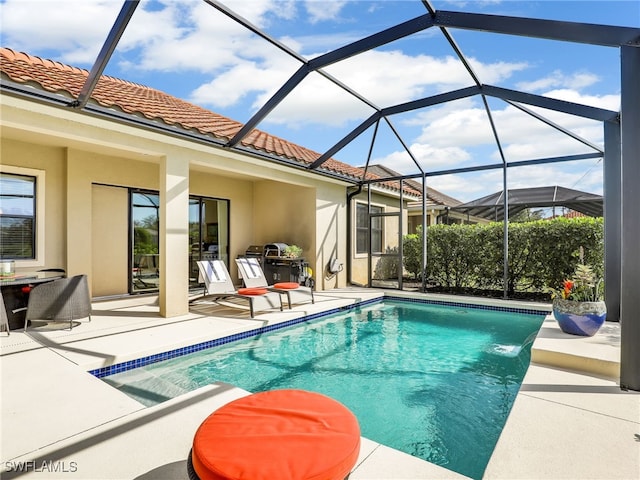 outdoor pool featuring a patio and a lanai