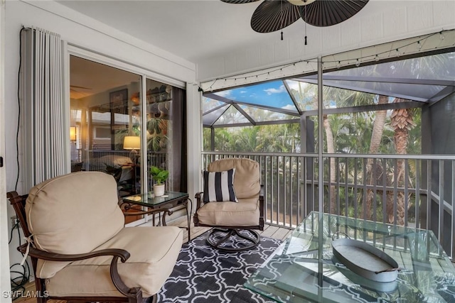 sunroom / solarium featuring ceiling fan