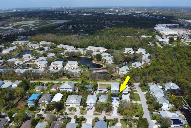 birds eye view of property with a water view and a residential view