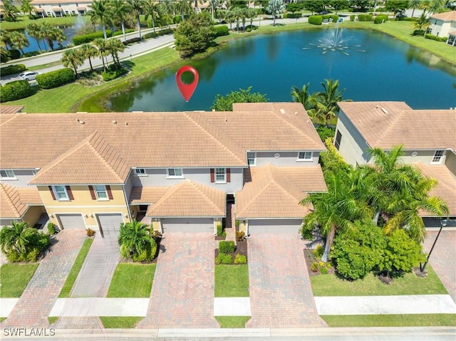 bird's eye view featuring a residential view and a water view