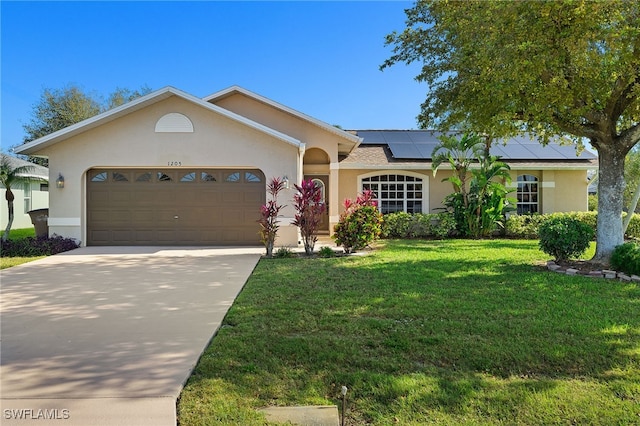 single story home with a garage, a front yard, roof mounted solar panels, and stucco siding