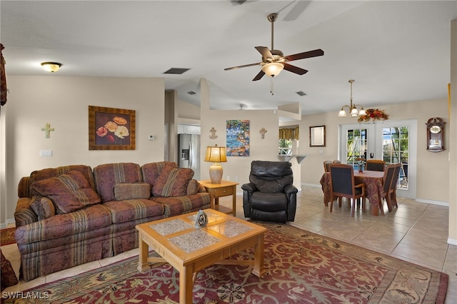 living room with light tile patterned floors, baseboards, visible vents, lofted ceiling, and ceiling fan with notable chandelier