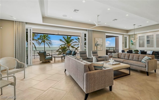 living room with light tile patterned flooring, visible vents, and recessed lighting