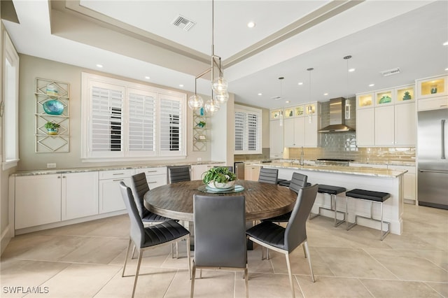 dining space with light tile patterned floors, visible vents, wine cooler, and recessed lighting