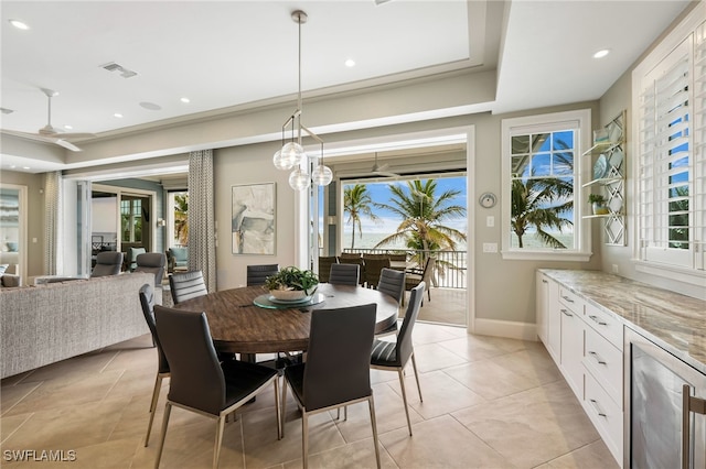 dining area featuring recessed lighting, wine cooler, visible vents, light tile patterned flooring, and baseboards