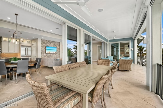 view of patio / terrace featuring outdoor dining area, a ceiling fan, and outdoor lounge area