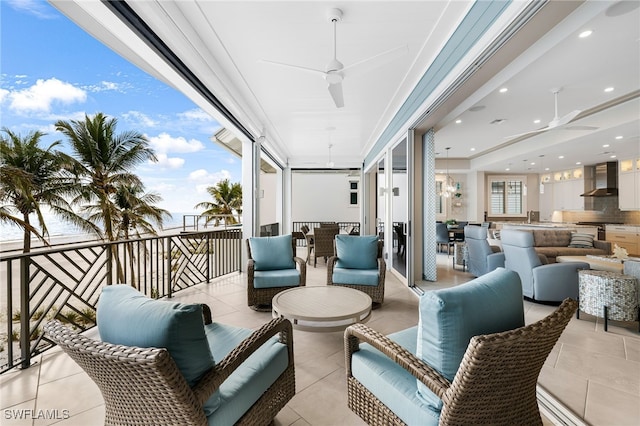 exterior space featuring area for grilling, a ceiling fan, and an outdoor hangout area